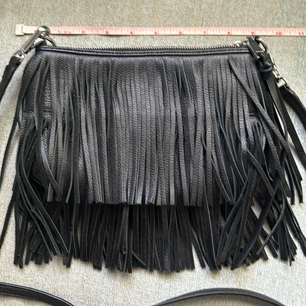 Cross body black fringe bag.